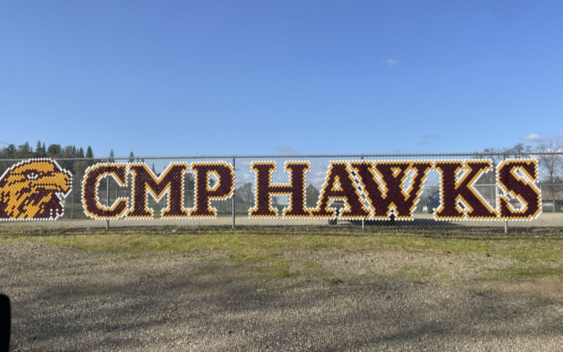 CMP hawks written on the fence. 